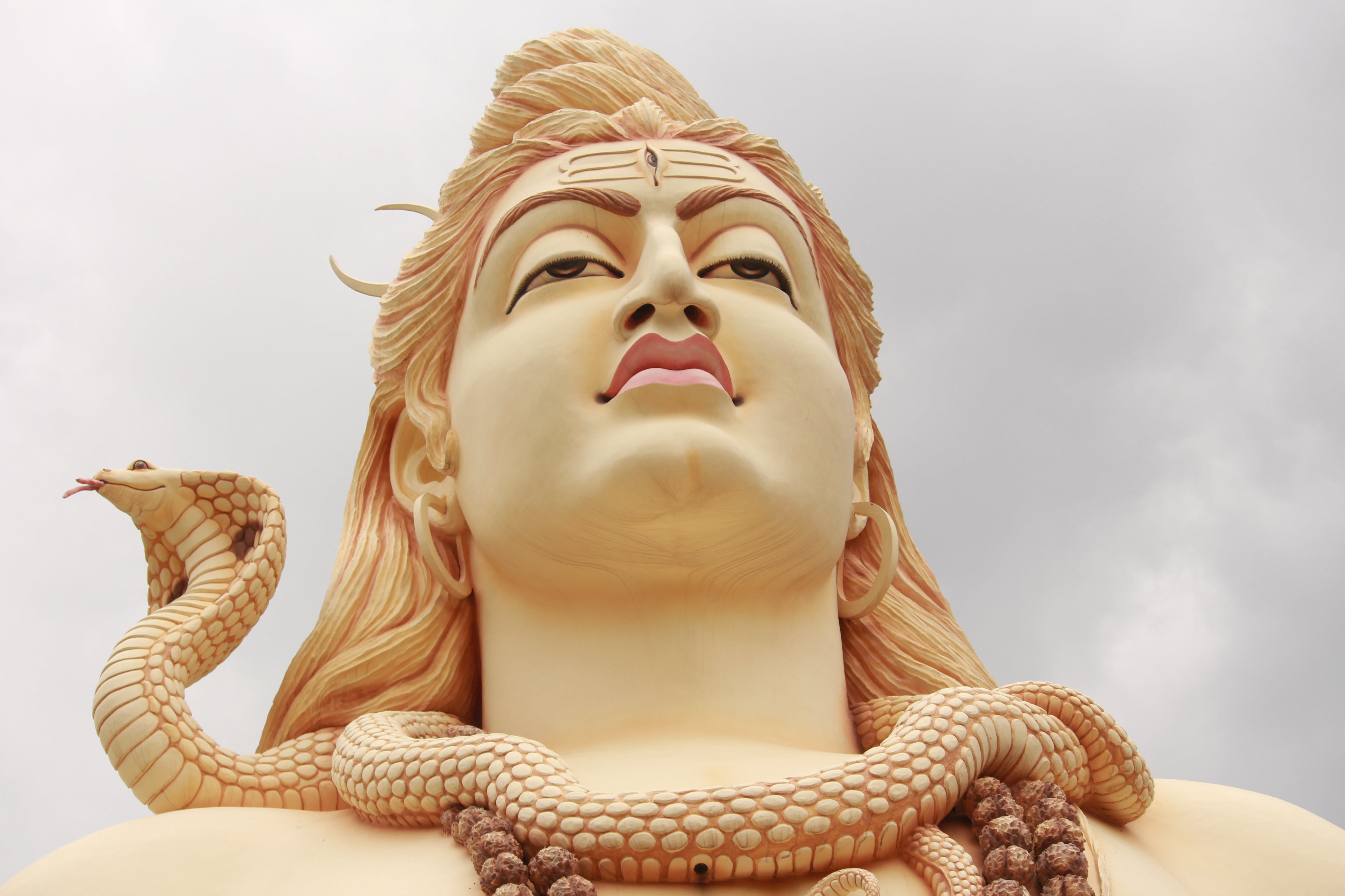 snake around neck of budda 