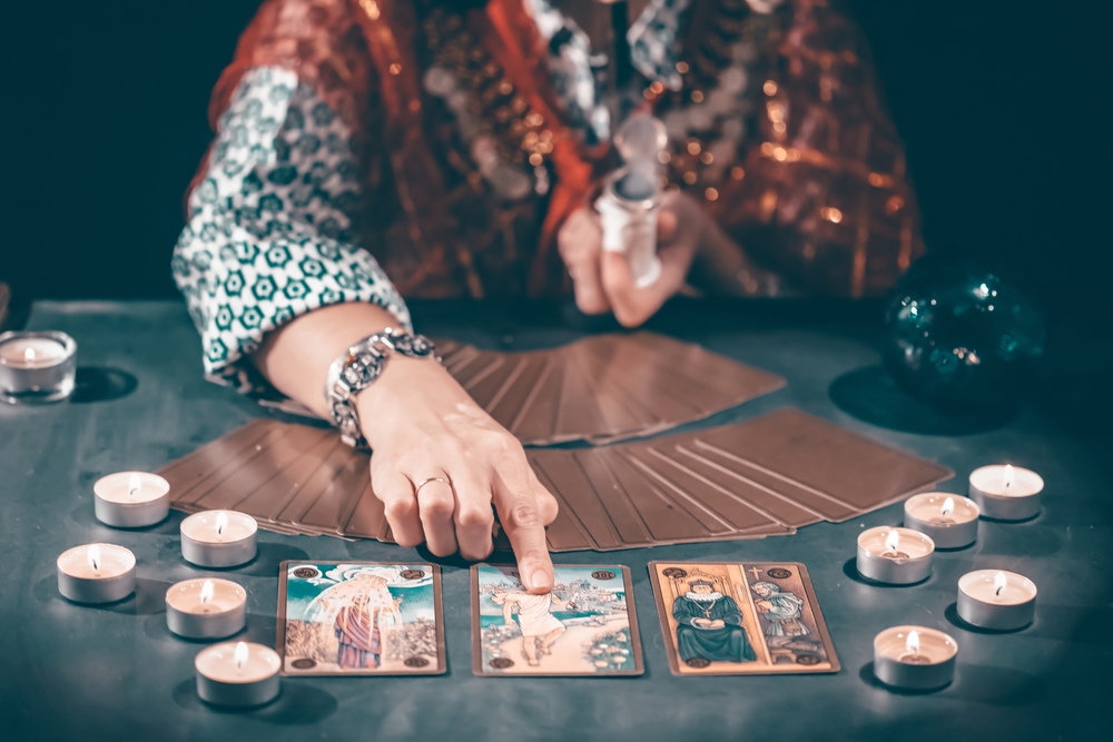 white women pulling tarot card