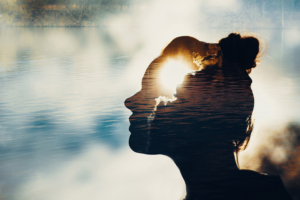 A woman with light radiating from her head symbolising otherworldly abilities.