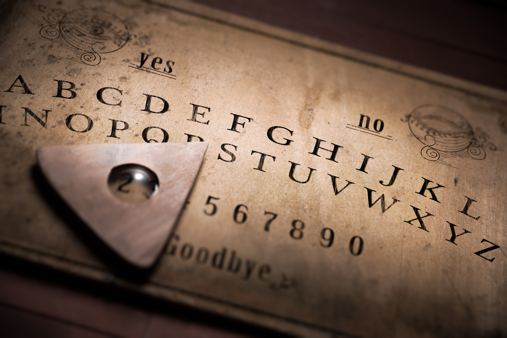 Talking board and planchette used on seances for communicating with the dead.