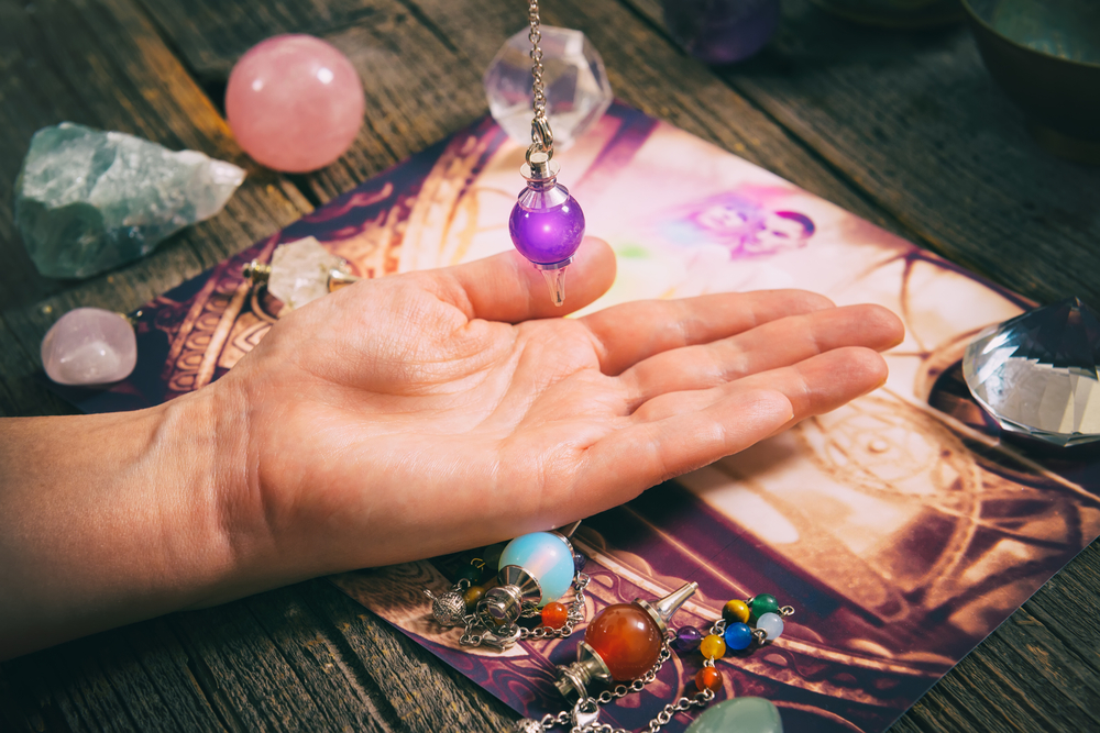 Palm reading, characterisation and foretelling of the future through the study of the palm with a pendulum.