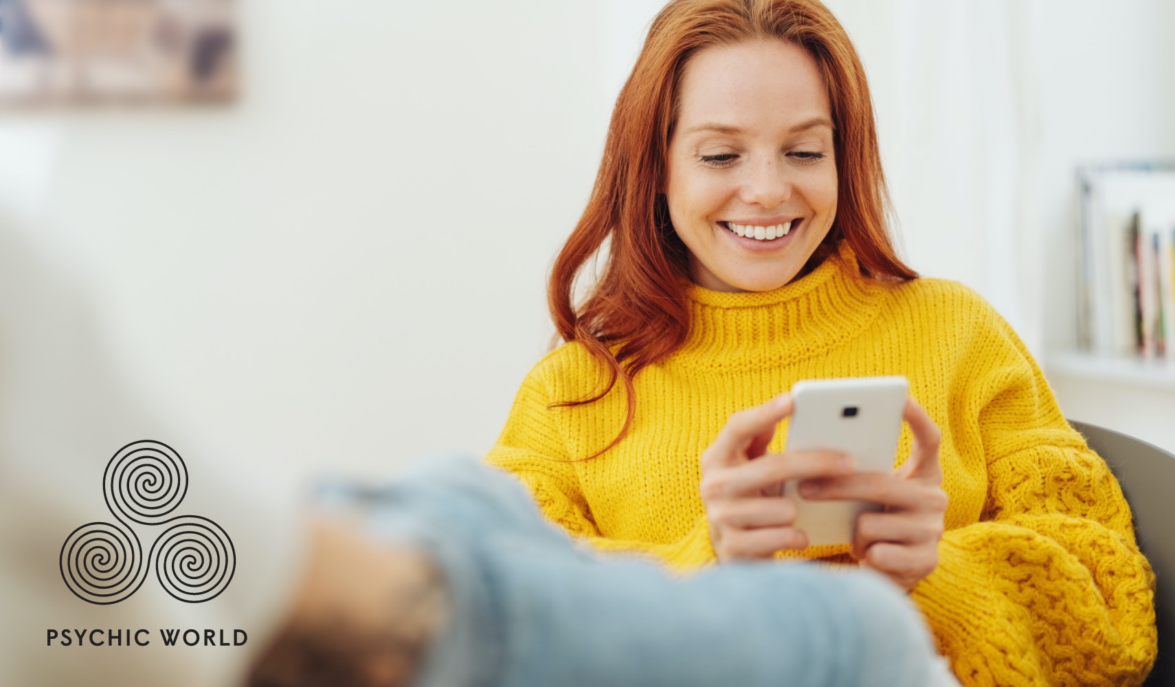 woman smiling looking at her smartphone